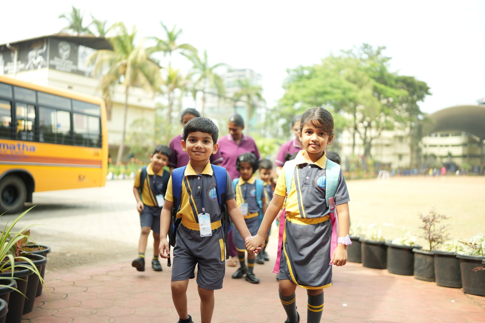 Primary students arriving at Devamatha School