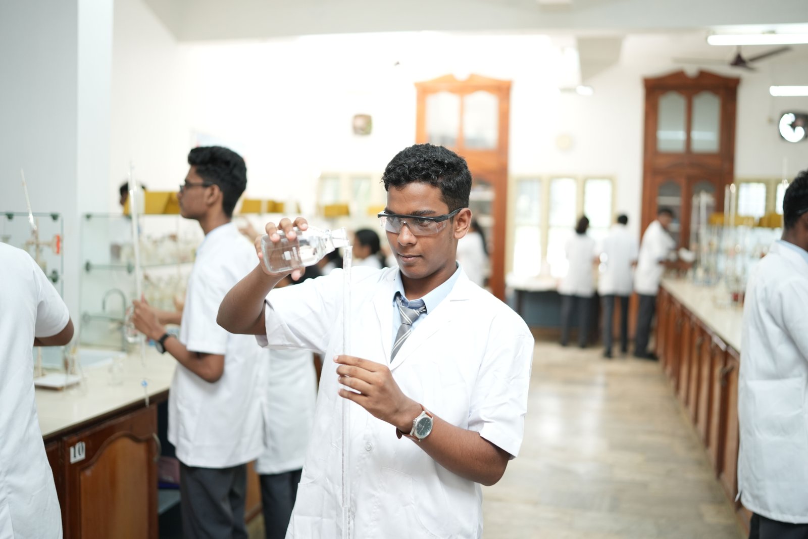 Devamatha student conducting a science experiment
