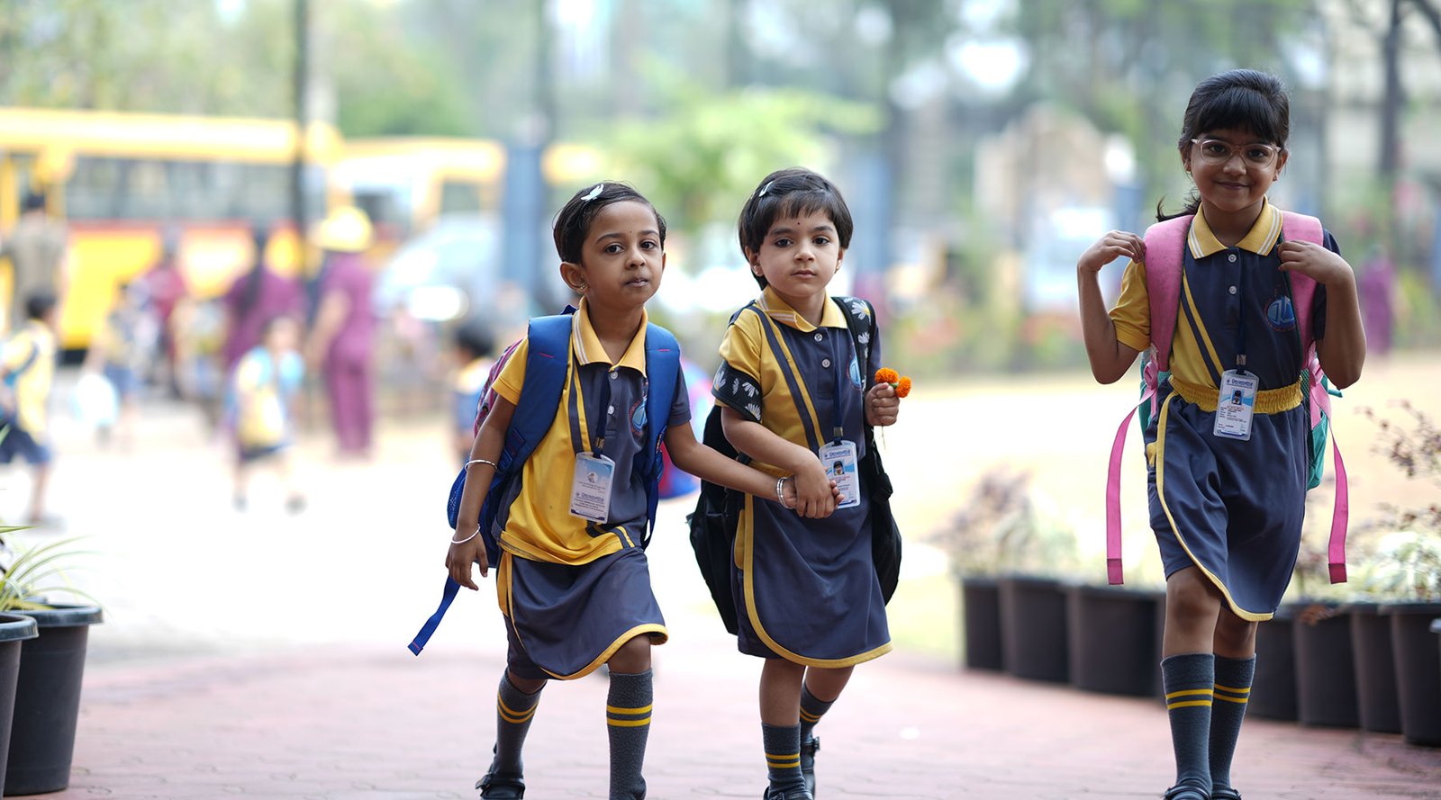 Young Devamatha students with their school bags