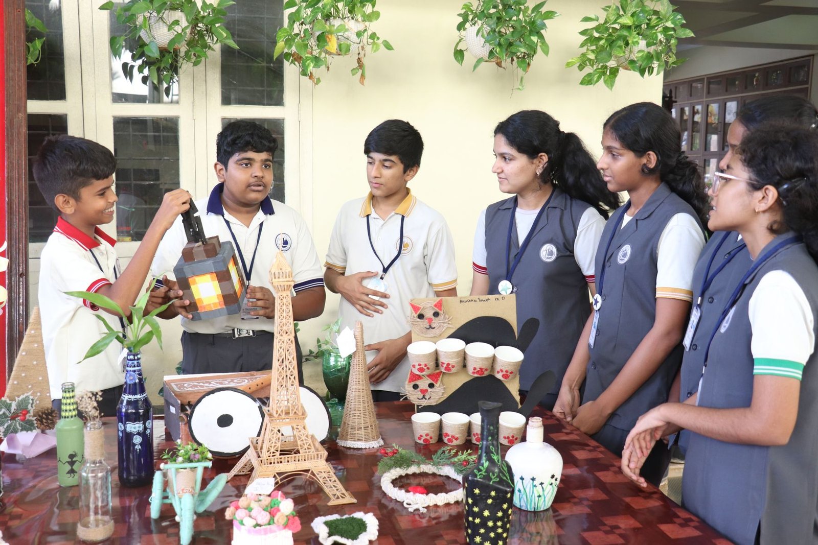 Students discussing their handmade exhibition projects